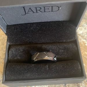 Black tungsten carbide, mens size 10. Never worn, smoke free home.